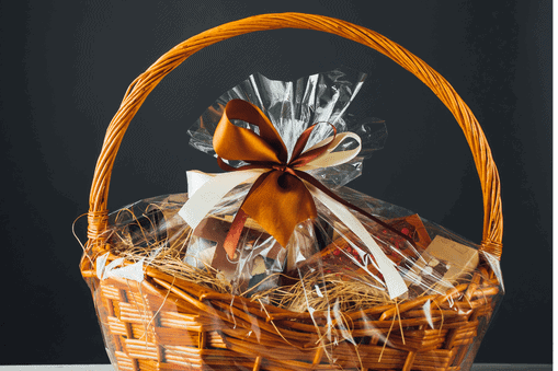 Gift basket tied with copper colored ribbon
